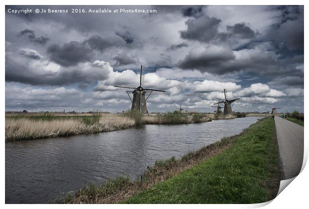 dutch mills at kinderdijk Print by Jo Beerens