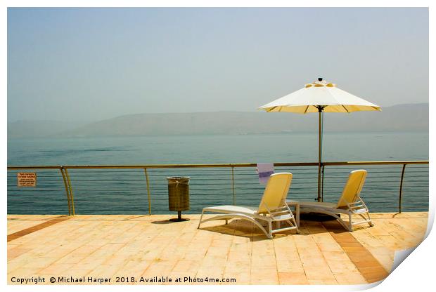 Sun beds and Brolly on the shores of Galilee Print by Michael Harper