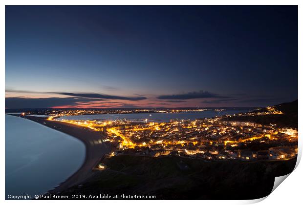 Portland at night looking towards Weymouth Print by Paul Brewer