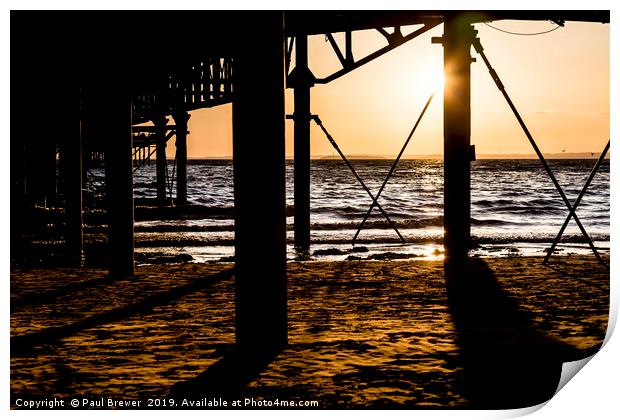 Sunset underneath Weston Super Mare Pier Print by Paul Brewer