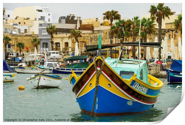 A small boats moored in marsaxlokk bay Print by Christopher Kelly