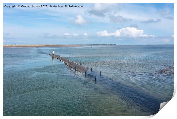 holy island causeway near high tide Print by Graham Moore